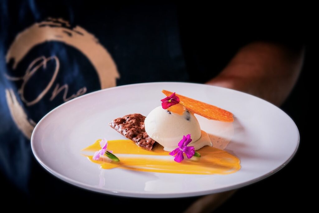 A curated dessert plate from One by Spork's chef driven menu.