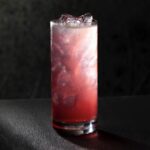 A pink and white cocktail for 28 years later representing the virus,