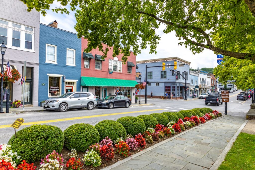 A street view of shops along a strip in an Appalachia city.