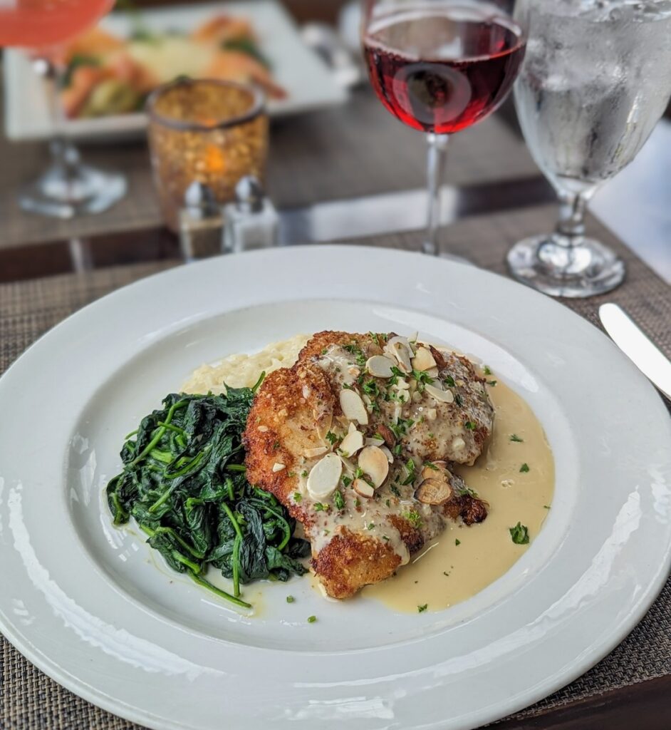 A plate from Bistro 19 with two glasses of wine.
