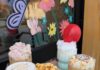 Taste Test Pittsburgh with These Food and Beverage Flights A four drink coffee flight from a Pittsburgh coffee shop with four different designed lattes on a wood tray themed to a carnival.