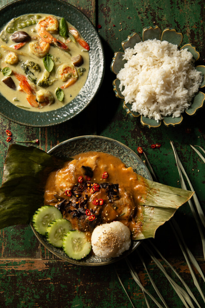 An above shot of three bowls of food filled with Delicious Southeast Asian delicacies.