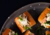 Famous Boston and Seattle Foods to Prep for Super Bowl LX A plate of mini shrimp sandwiches.