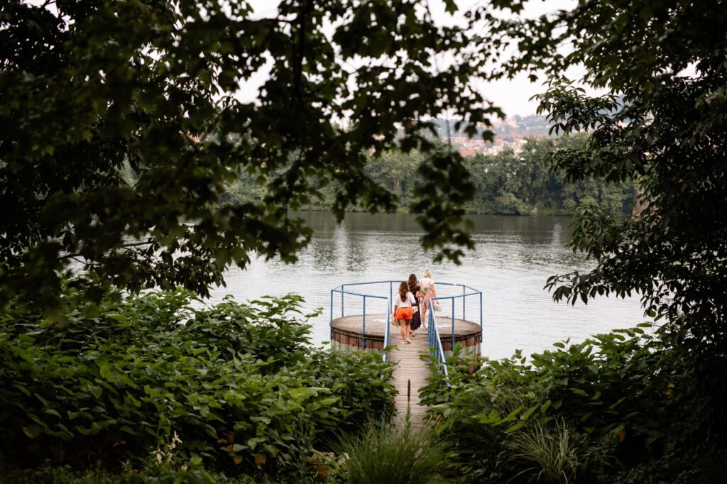 Three sisters step onto a river landing for a bike picnic in Pittsburgh.
