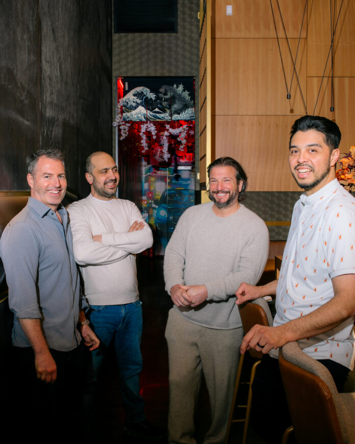 Four men stand next to each other smiling. They are Chefs and Resturants Leading the Way in Pittsburgh's Culinary Excellence