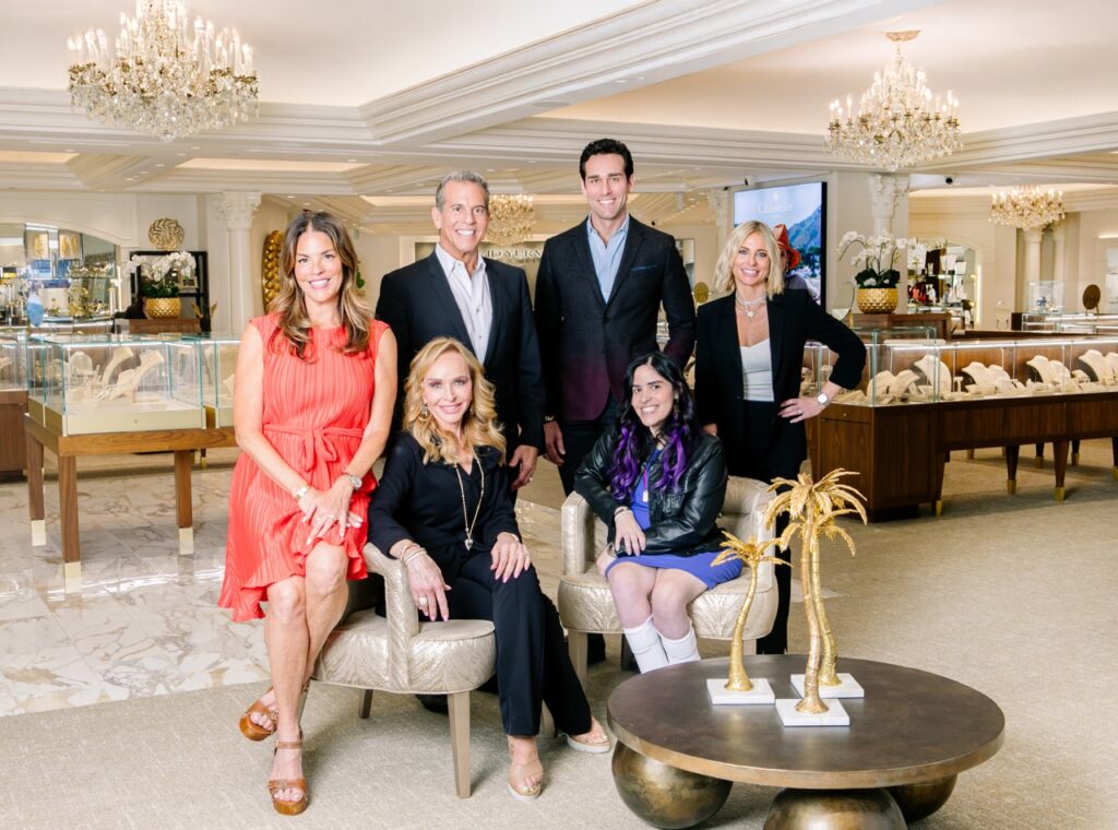 The Louis Anthony family sit in their jewelry showroom.