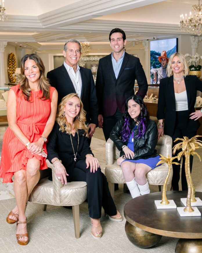 The Louis Anthony Jewelers family sit together in the showspace.