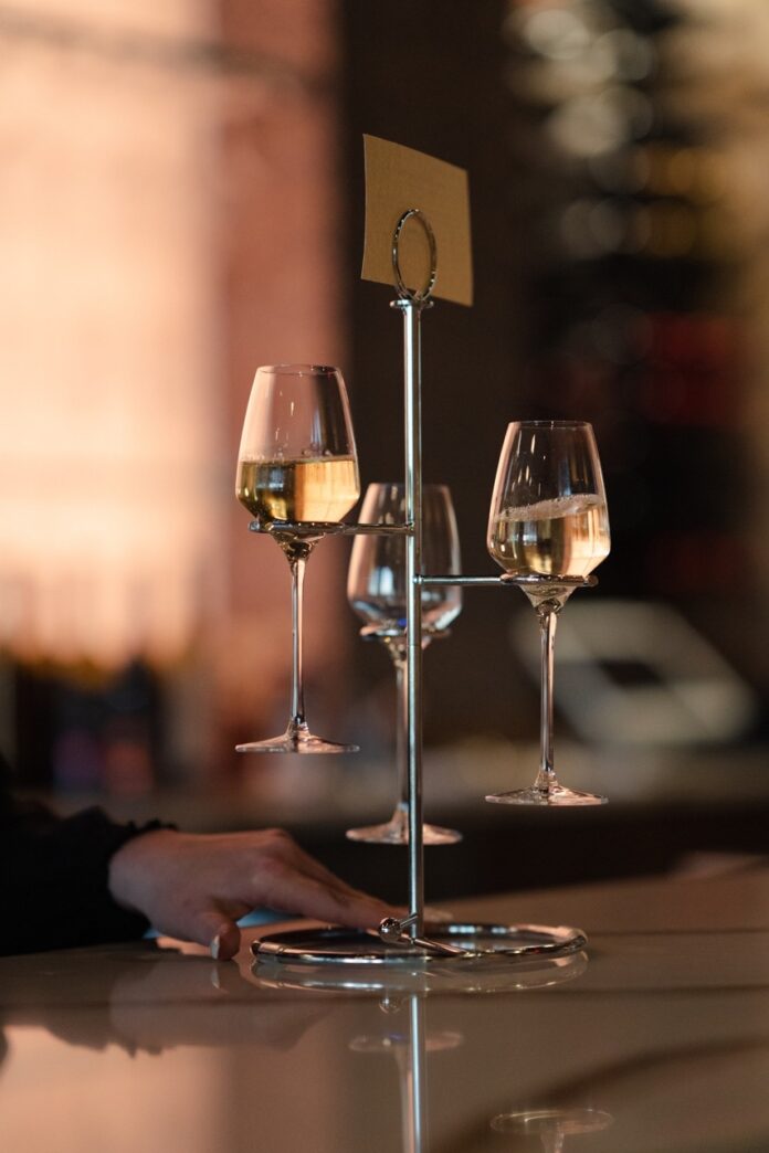 A set of wine glasses on a rack.