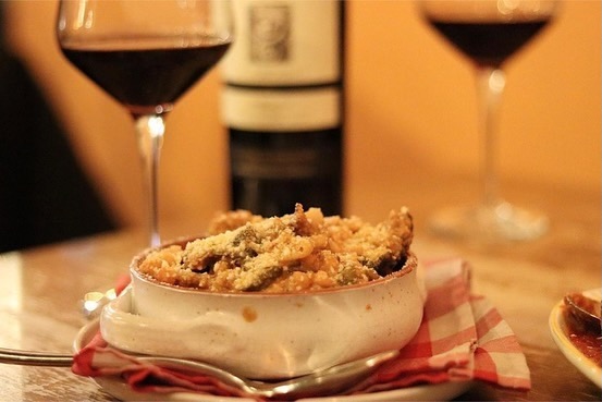 Two glasses of wine and beans and greens from Garbarino's.