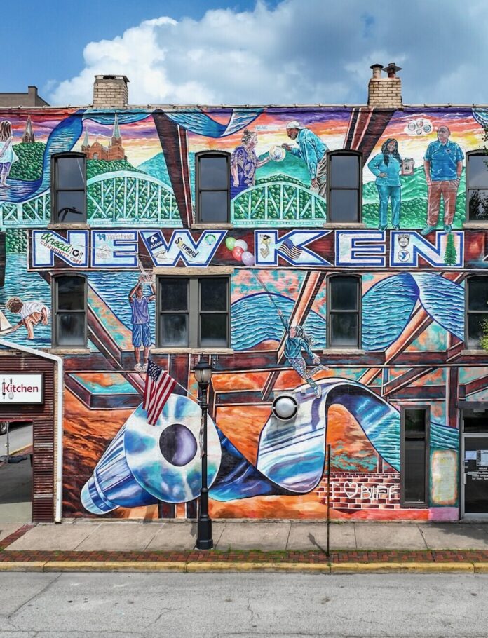 A mural in New Kensington reading "New Ken" in bright blue letters.