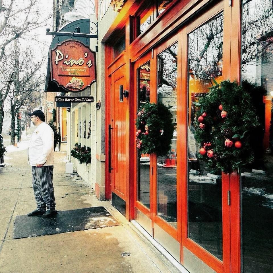 The curbside of Point Breeze, where a chef stands outside of Pino's