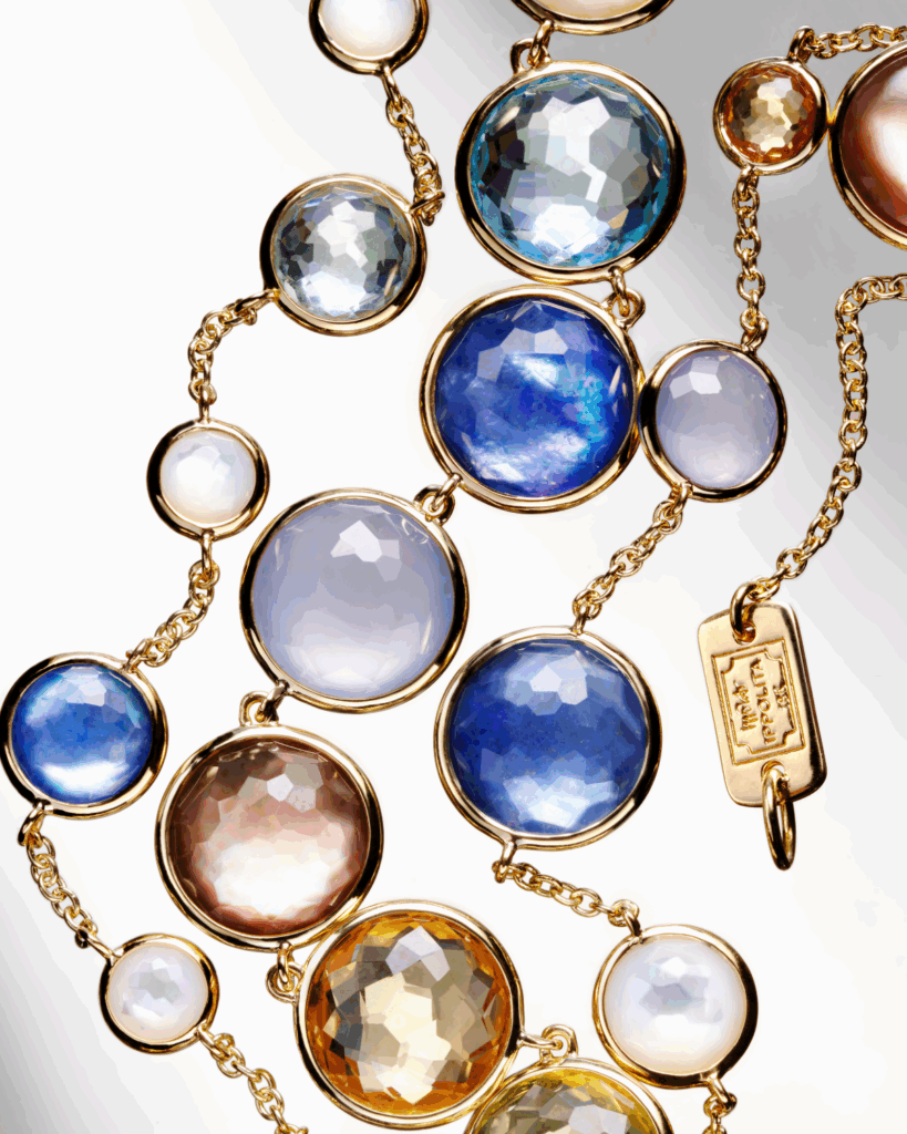 The Lollitini Lollipop Collection’s Long Necklace is a mixture of 18K yellow gold, green gold citrine, blue topaz, mother-of-pearl, rock crystal, lapis lazuli, dyed blue chalcedony, and orange citrine.