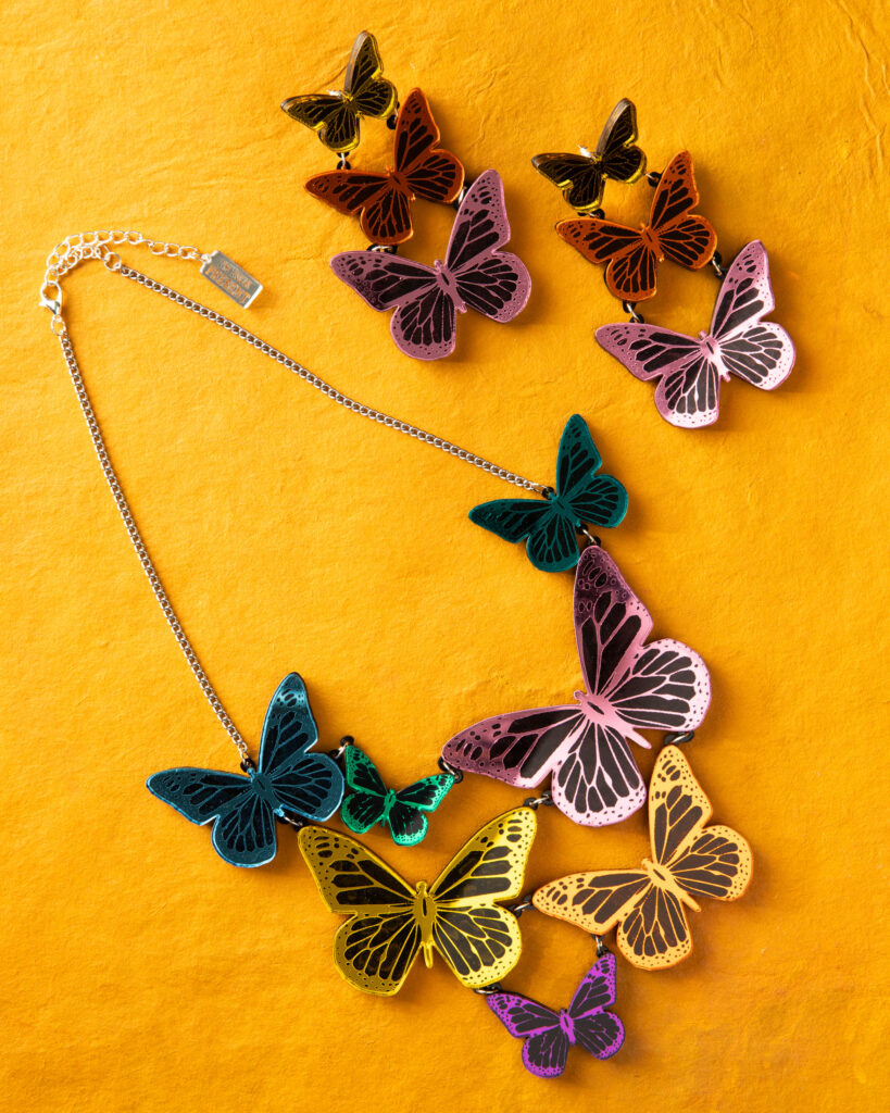a radiant butterfly necklace and companion earrings