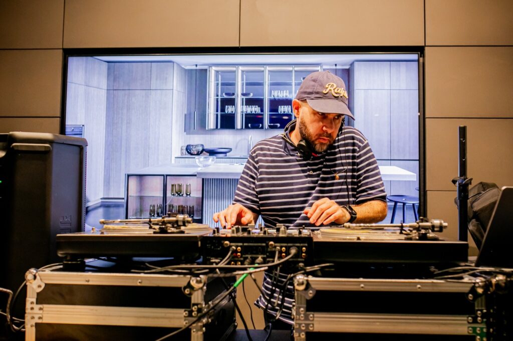 A DJ plays with his record board.