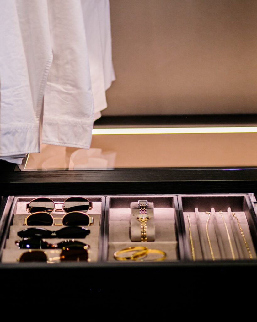 A case of sunglasses and jewelry.