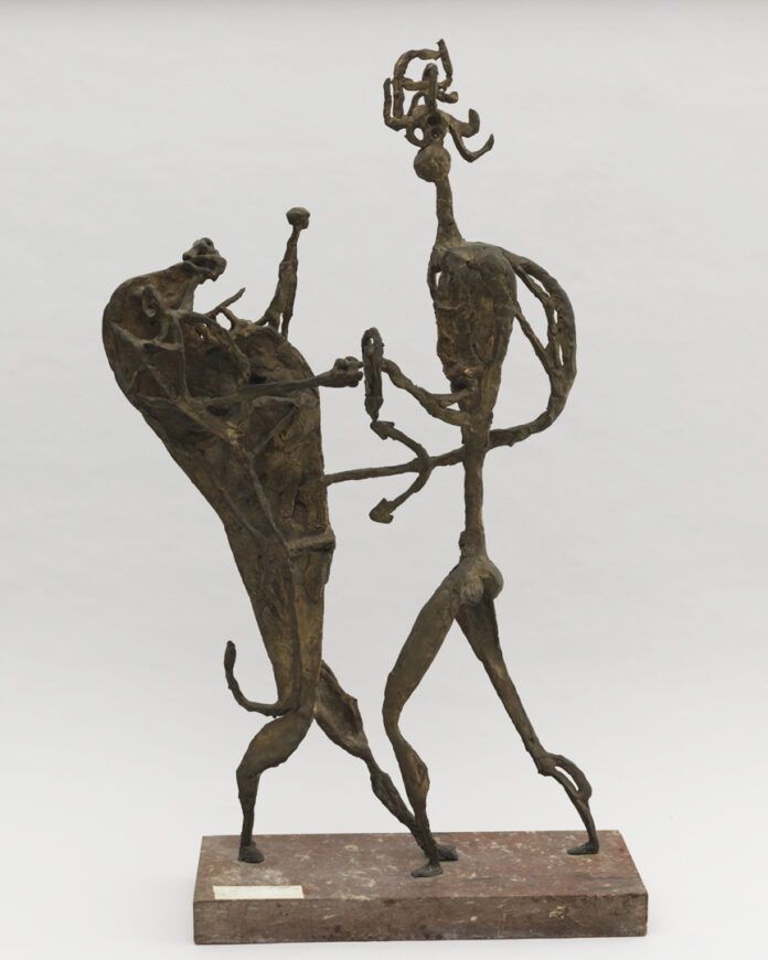 A statue of a man and a bull dancing made by a Black artist.