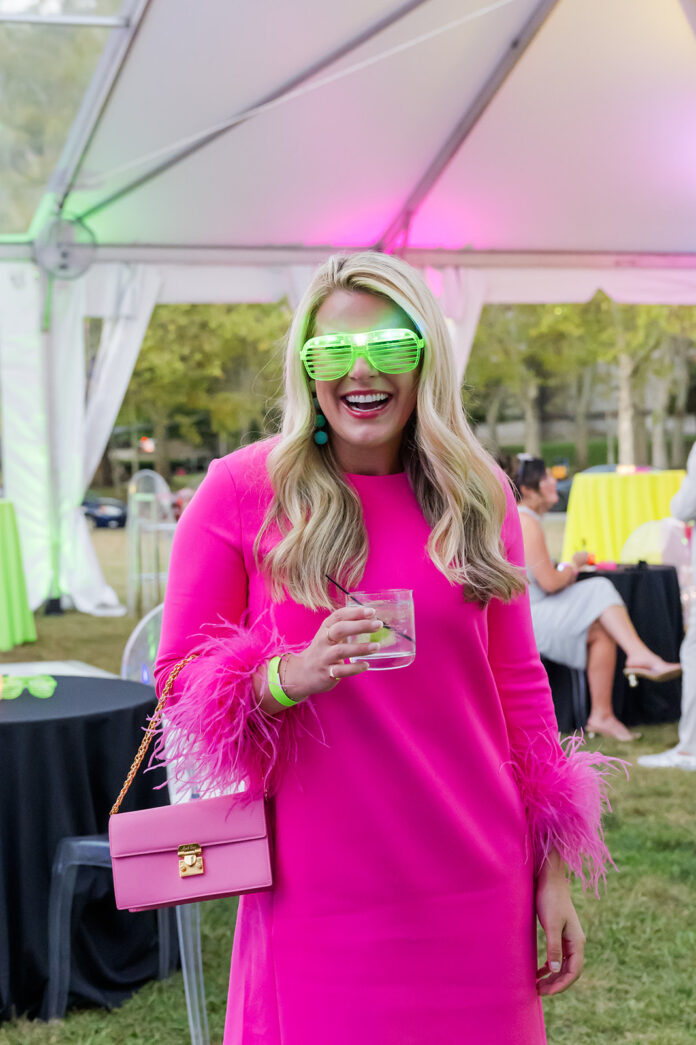 Glow in the park, lady in pink dress smiling