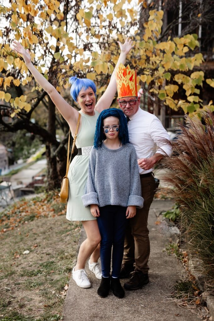 A three piece family as Joy, Sadness, and Anger.