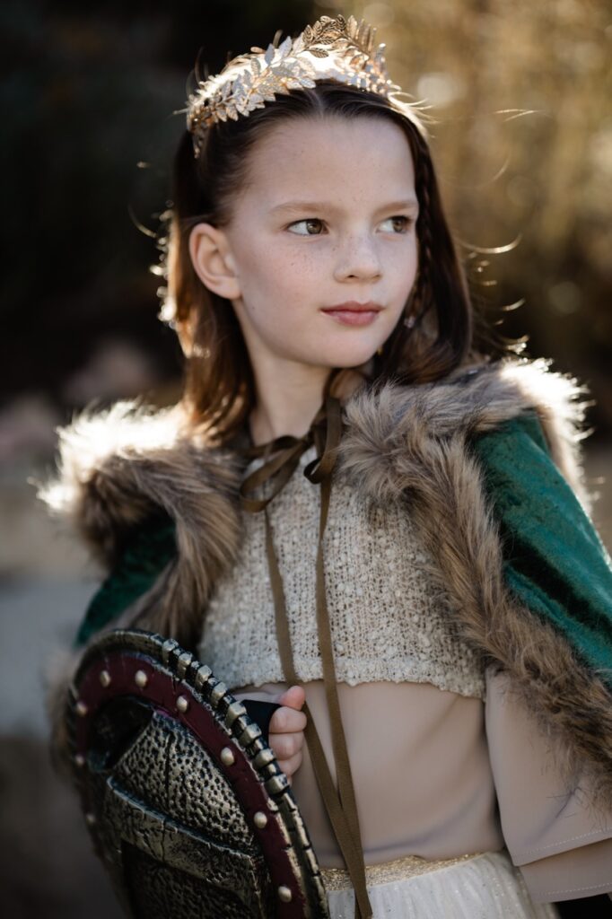 A girl in a warrior Halloween costume.