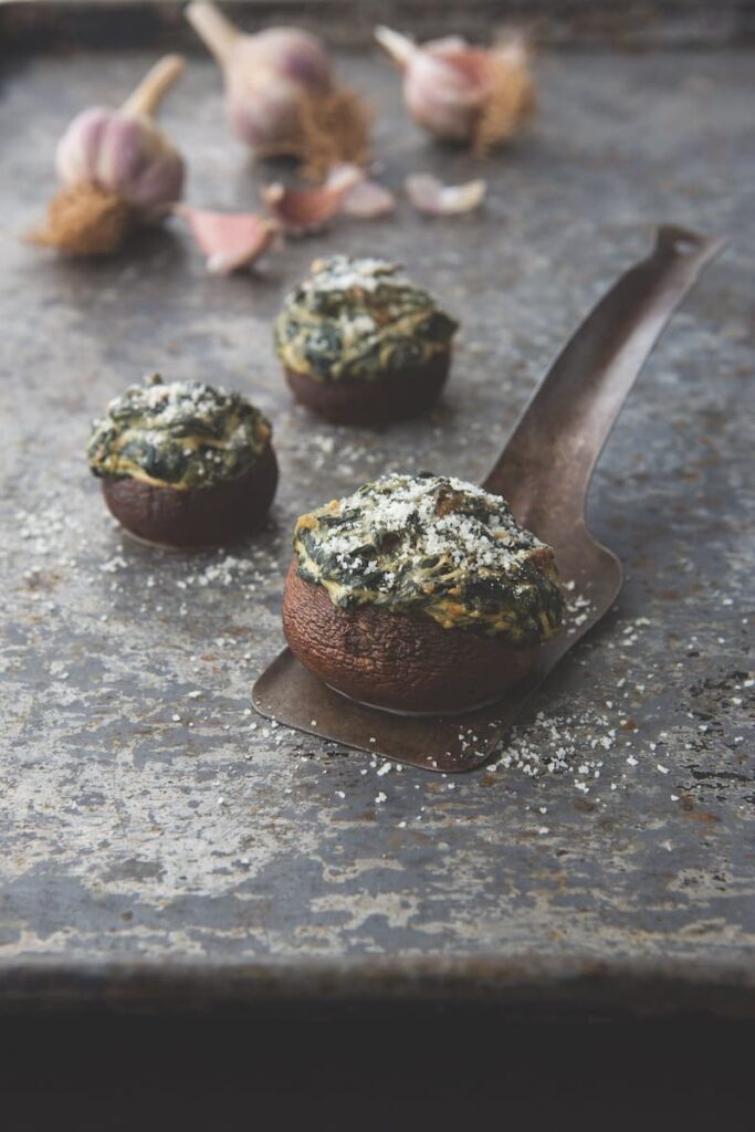 A close-up view of a variety of mushrooms in different shapes and sizes.