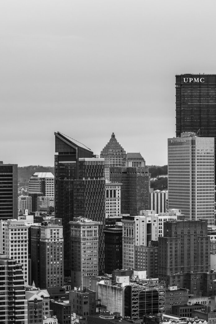 The buildings of Pittsburgh in black and white from afar.