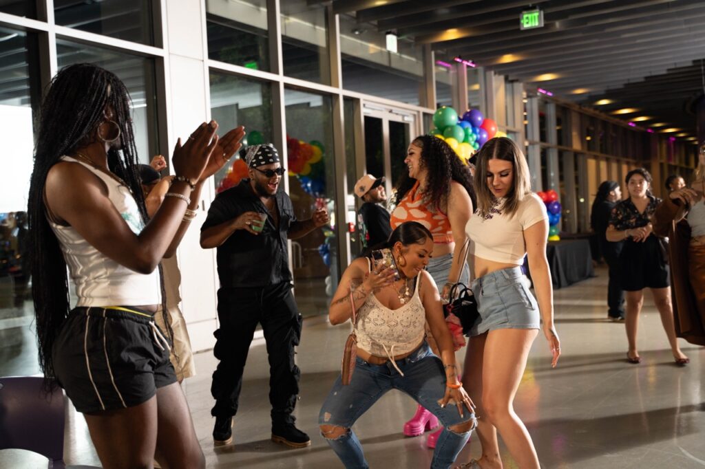 A group of women dance together.