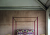 The Jewel Tone Design Trend Your Home is Missing The Rita Four-Poster Canopy Bed by Julian Chichester delivers a splash of classic red. The exact shade is neither hushed nor loud, but rather like a human pulse: warm, alive, resilient, and positive. jewel tone home design