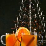 A vibrant and eye-catching spiked cider featuring a delightful mix of fall flowers and foliage. The arrangement showcases the warm hues of orange, red, and yellow, perfectly capturing the essence of the season.