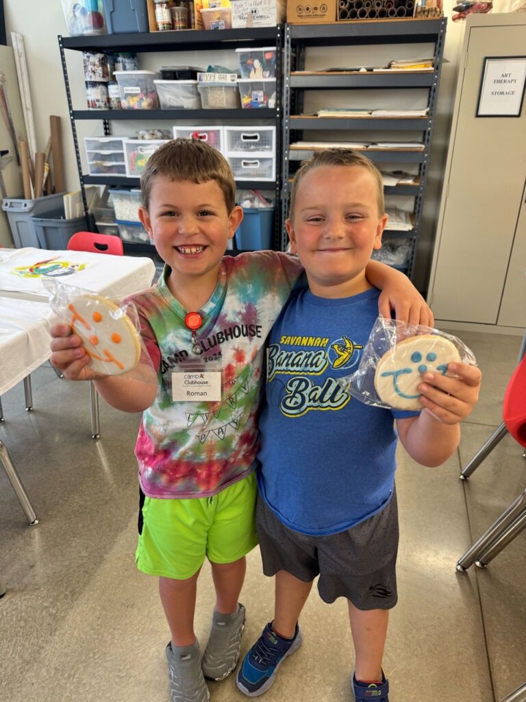 Two kids hold Smiley cookies from Eat n Park in Pittsburgh.