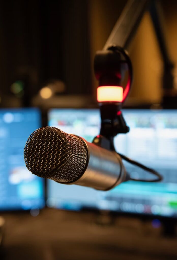 A radio microphone sits ready for a host to speak into it.