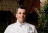 Cozy Christmas Recipes from Chef David Haick at Glendorn Chef David Haick in a white uniform holds a plate of golden-brown pancakes.