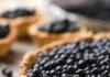 Blueberry Concord Grape Tart A large, rustic tart with a golden crust filled to the brim with fresh blueberries.