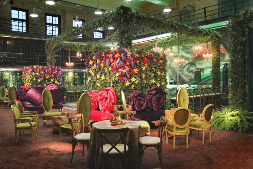 fairy flower wall with purple sofas and yellow chairs