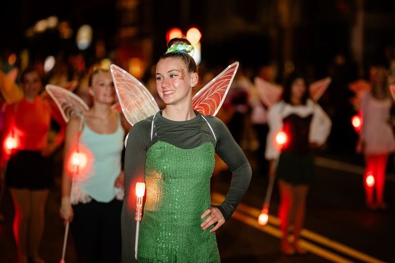 Girl in fairy costume with wings at Pittsburgh Halloween event.