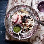 A risotto with applestroop drizzle on a pattern plate.