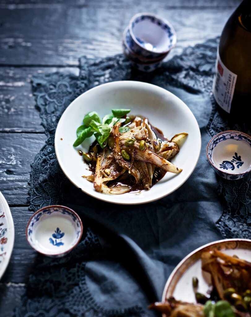 A bowl with a dutch Chicory inside.