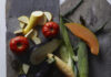 Shop Local Family Farms Around Pittsburgh Vegetables lay about from local farms on a black sheet of paper.