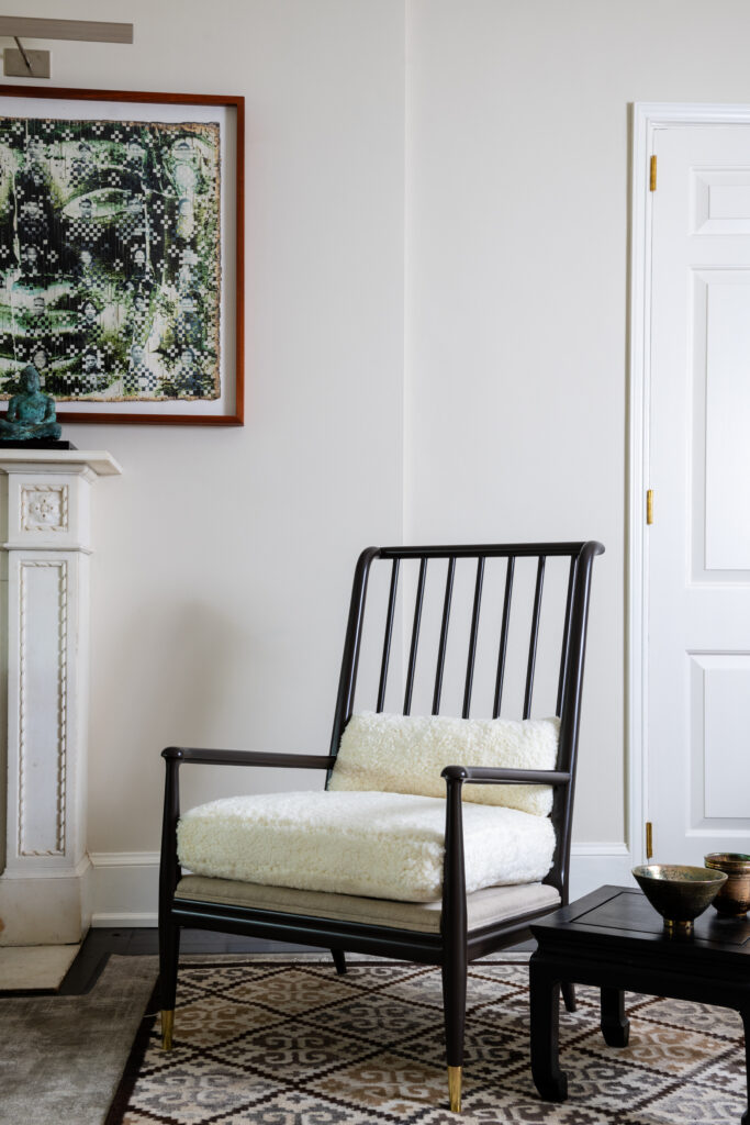 simple black chair with white cushions