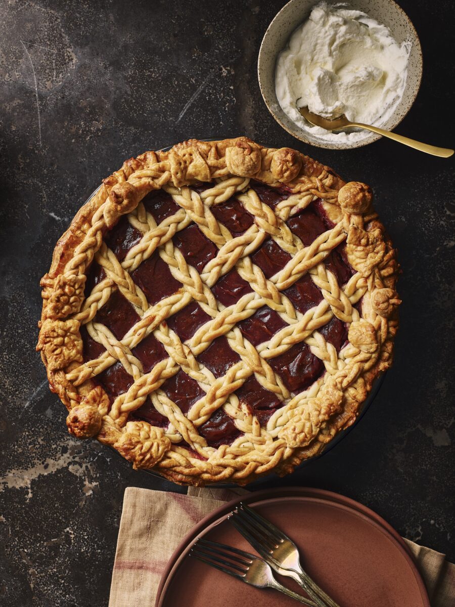 A pie with purple potatoes and bourbon honey with lattice work over top.