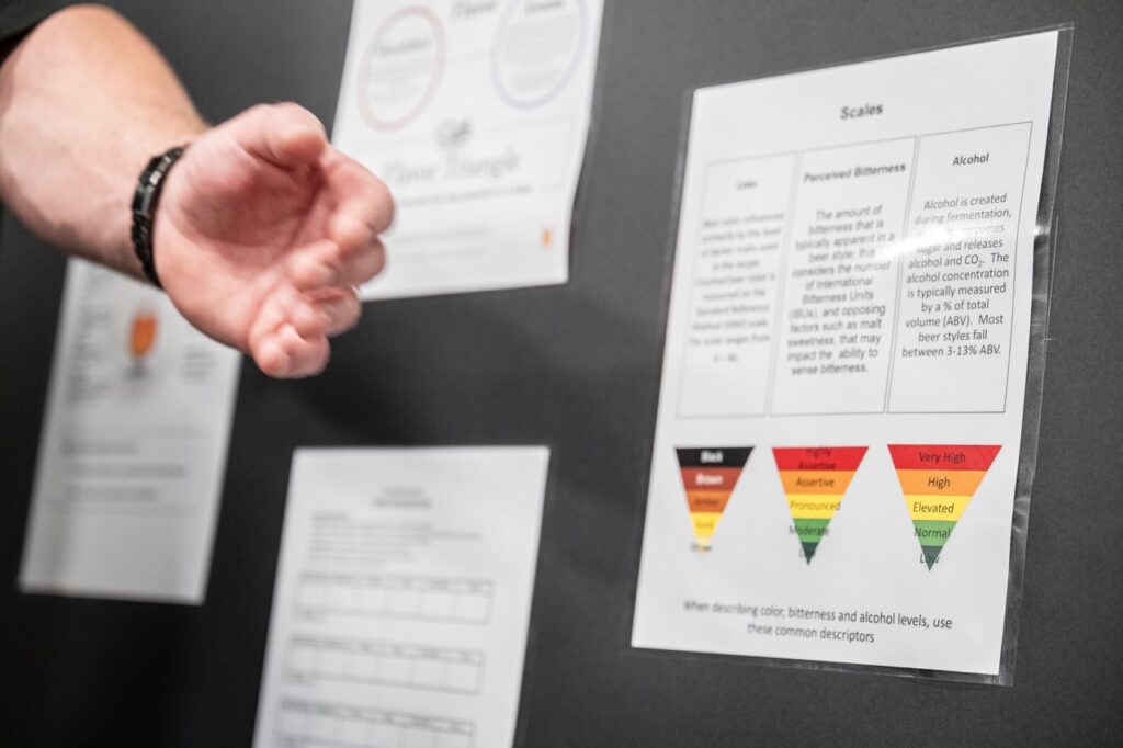 A man points to a diagram on a board.
