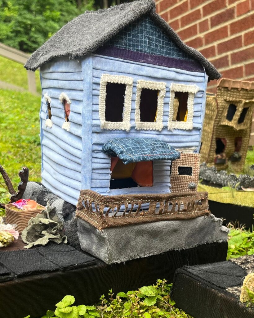 Blue craft house on a black table
