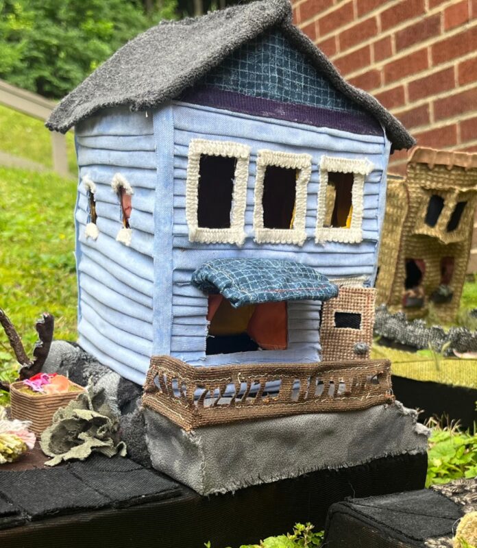 Blue craft house on a black table