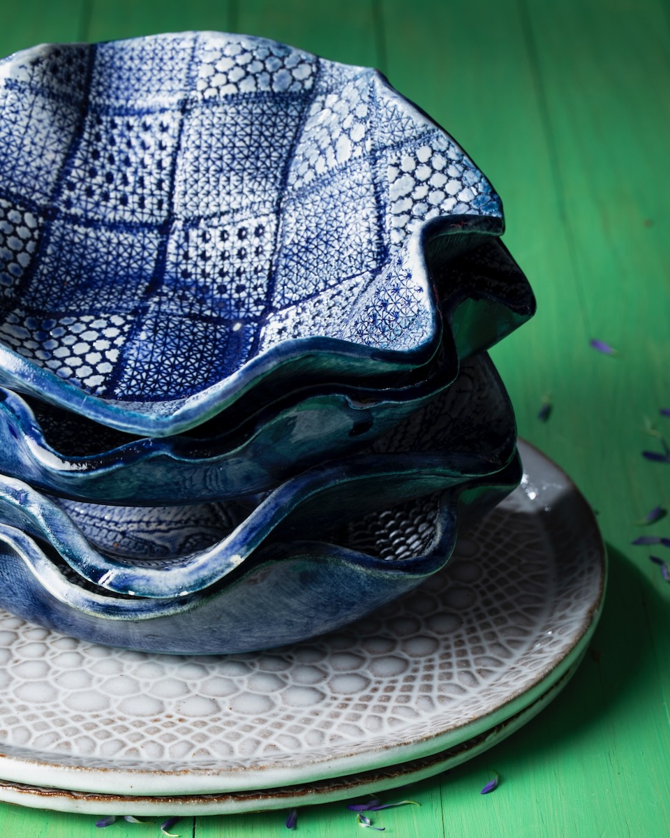 Cafted image of blue plates and green background