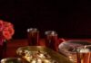 Celebrate Diwali with These Authentic Indian Recipes Diwali Onion Bhaji and Dahi Papdi Chaat on gold serve ware with red accent decorations.