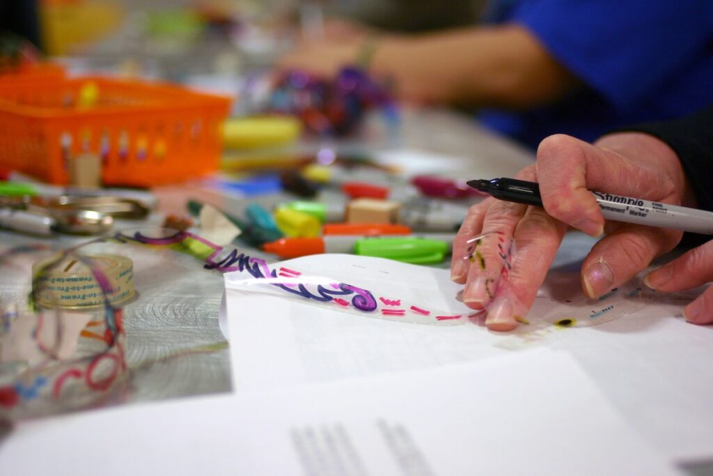 close up of people making crafts