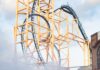 Fun Frights for All Ages at Kennywood’s Phantom Fall Fest A group of park goers at Kennywood walk through thick fog in front of a roller coaster.