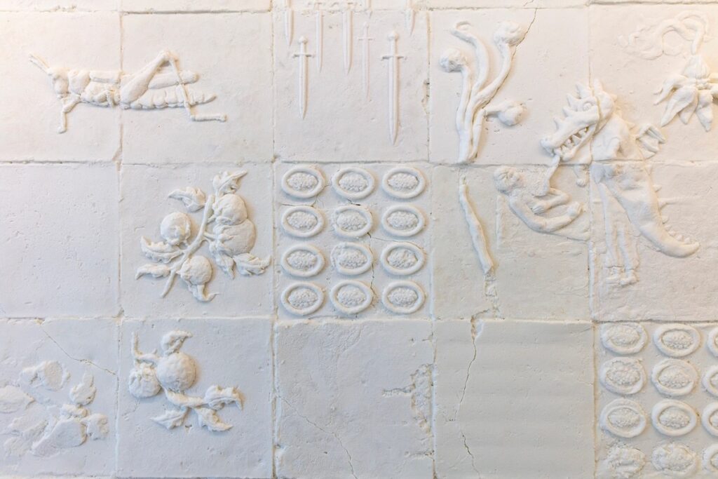 Various salt squares with patterns carved into them.