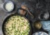 Risi e Bisi (Rice and Peas) A creamy pot of Risi e Bisi (Venetian rice and peas) and a serving on a blue and white plate, garnished with Parmesan cheese and a side of chopped onion.