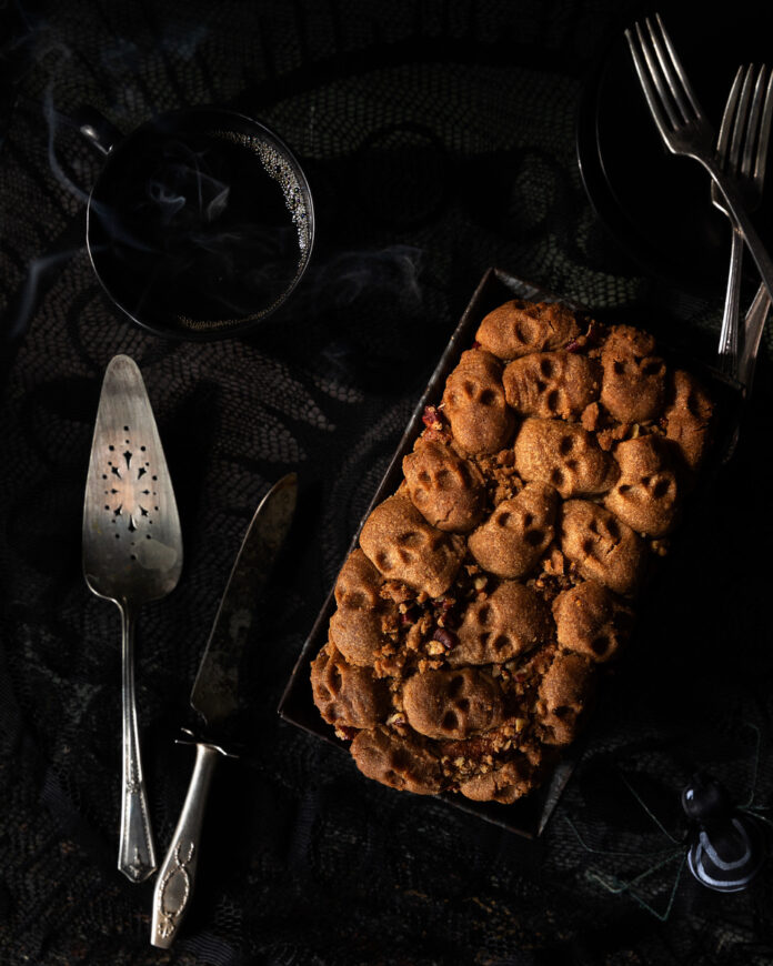 TABLE Magazine Halloween Coffee Cake A Halloween-themed coffee cake on a black background.