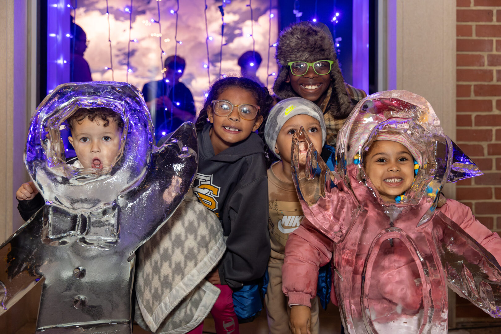 Winter Wonderland kids smiling in front of lights